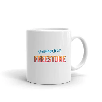 Greetings from Freestone Postcard mug preview